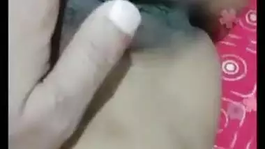 Desi gal grabs camera in time to record how she rubs own XXX pussy