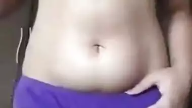 Indian girl takes colorful clothes off to bare hairy pussy for some porn