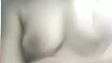 Chubby shy Indian girl showing round boobs to lover